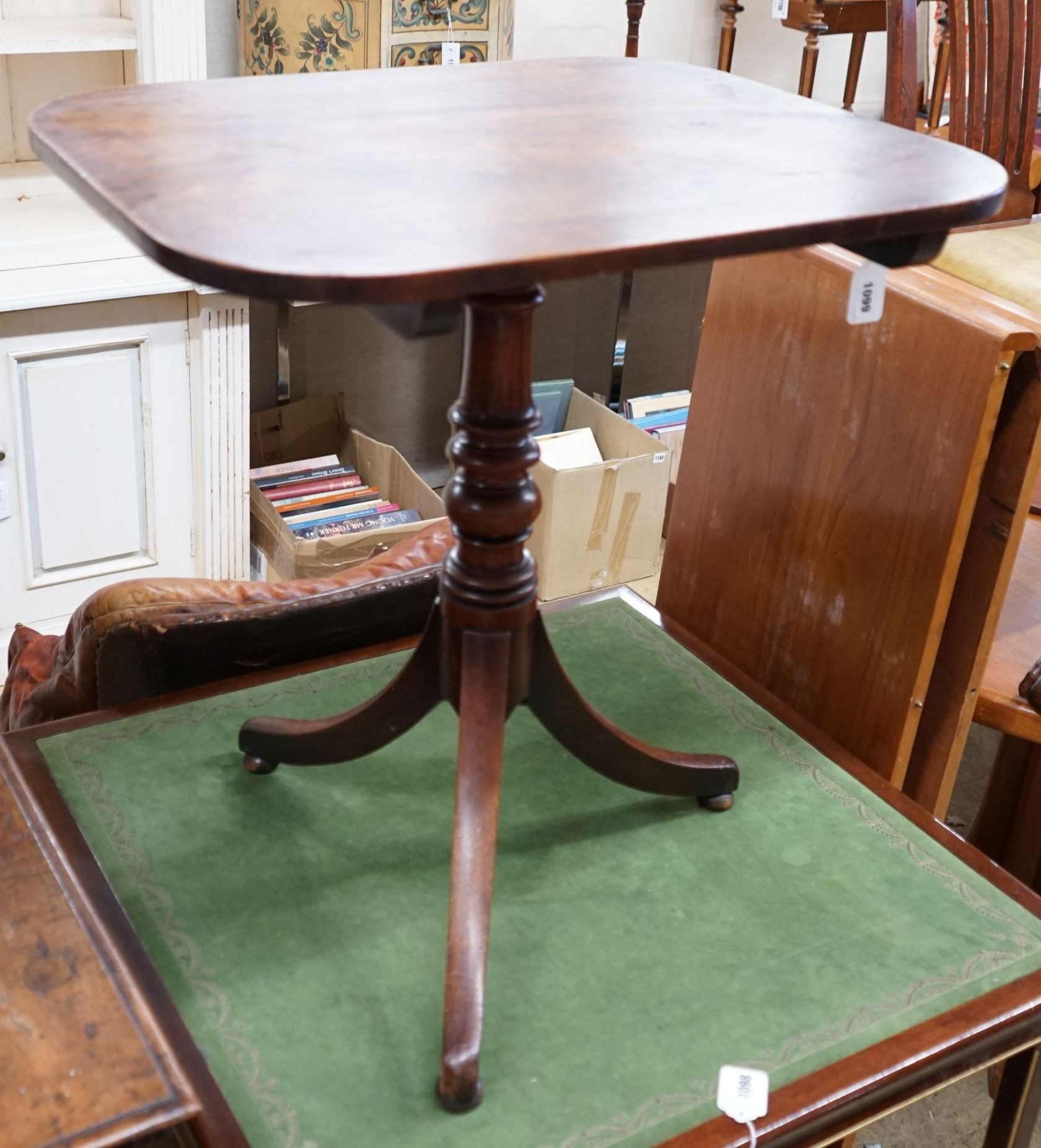 An early 19th century mahogany rectangular tilt top tripod table, width 64cm, depth 54cm, height 69cm